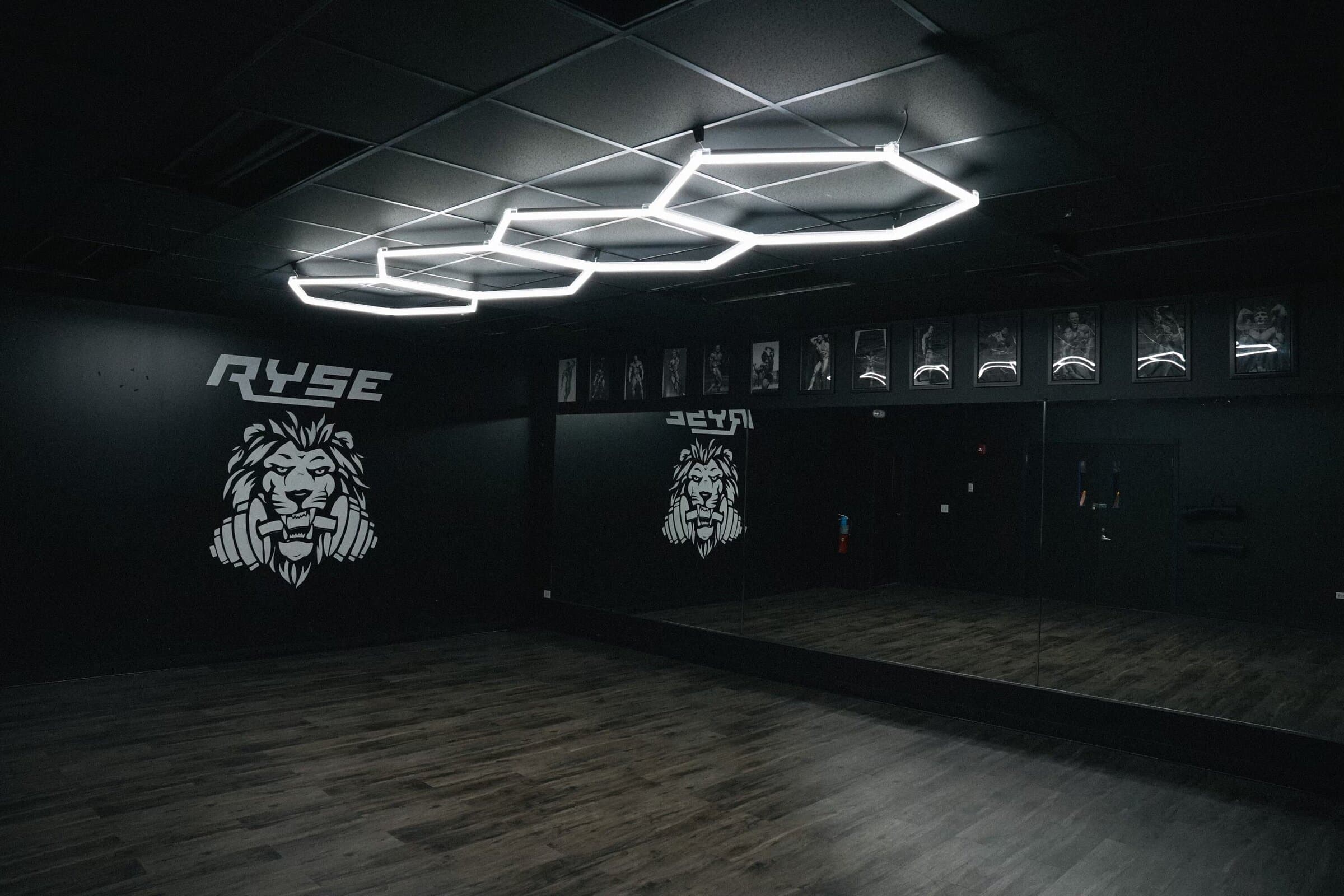 Ryse Athletic Club main floor under the signature hex lighting